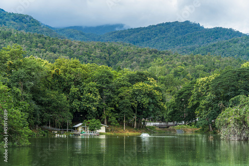 landscape lake views at Ang Kaew Chiang Mai University in nature forest Mountain views spring cloudy sky background with white cloud.