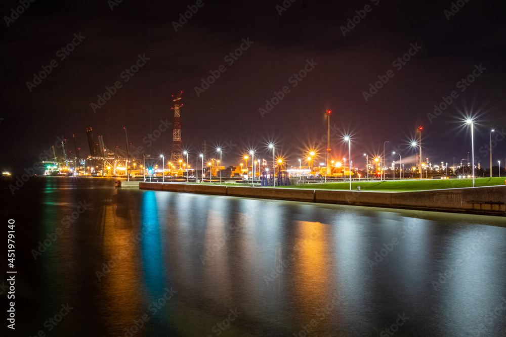 heavy industry near waterway causing emmissions. High quality photo