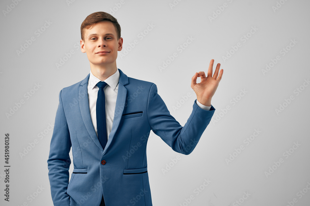 cheerful business man in suit gesturing with hand emotions posing studio cheerful business man in suit gesturing with hand emotions posing studio
