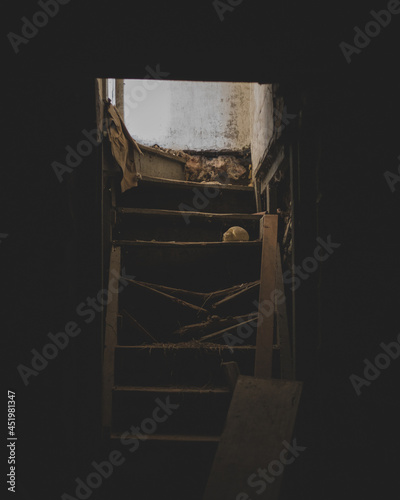 Dark abandoned house with broken stairs in the basement