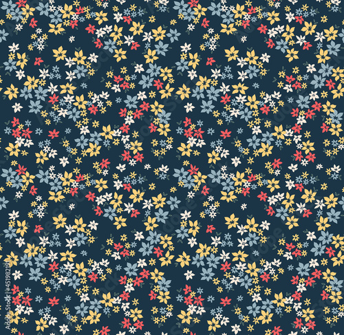 Vector seamless pattern. Pretty pattern in small flowers. Small colorful flowers. Dark navy blue background. Ditsy floral background. The elegant the template for fashion prints. Stock vector.