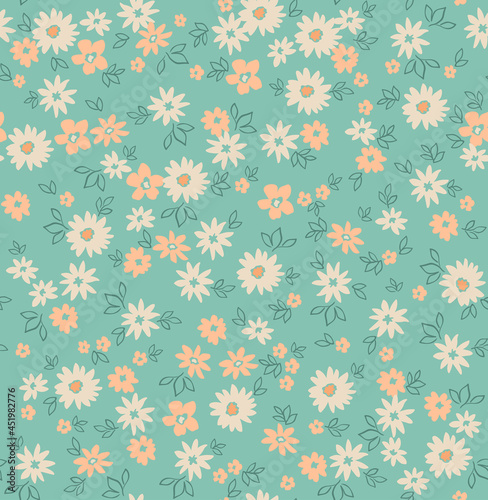 Beautiful floral pattern in small chamomile flowers. Small pastel flowers. Pastel turquoise background. Ditsy print. Floral seamless background. The elegant the template for fashion prints. Stock 