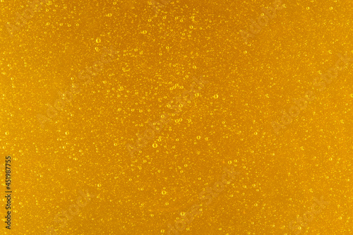 Texture of honey with bubbles. Healthy food concept background. Macro detail surface of honey.