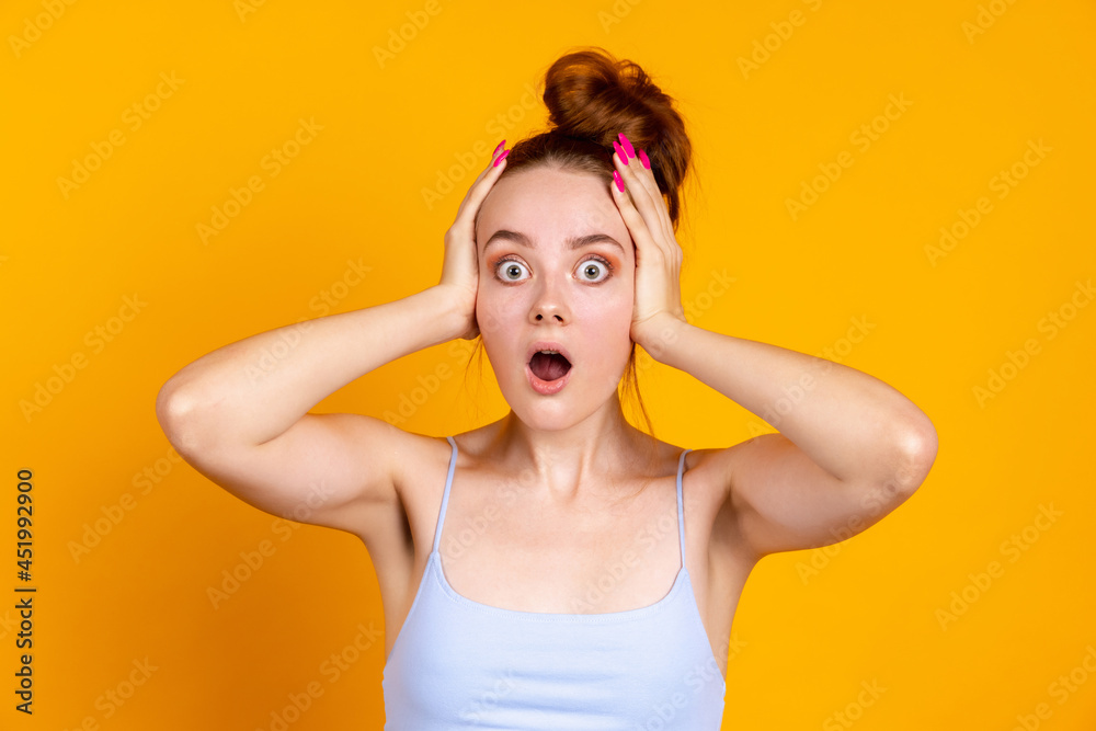 Portrait of beautiful girl isolated on yellow studio background. Female fashion model in casual clothes. Concept of human emotions, facial expression, natural beauty, youth Portrait of beautiful girl isolated on yellow studio background. Female fashion model in casual clothes. Concept of human emotions, facial expression, natural beauty, youth