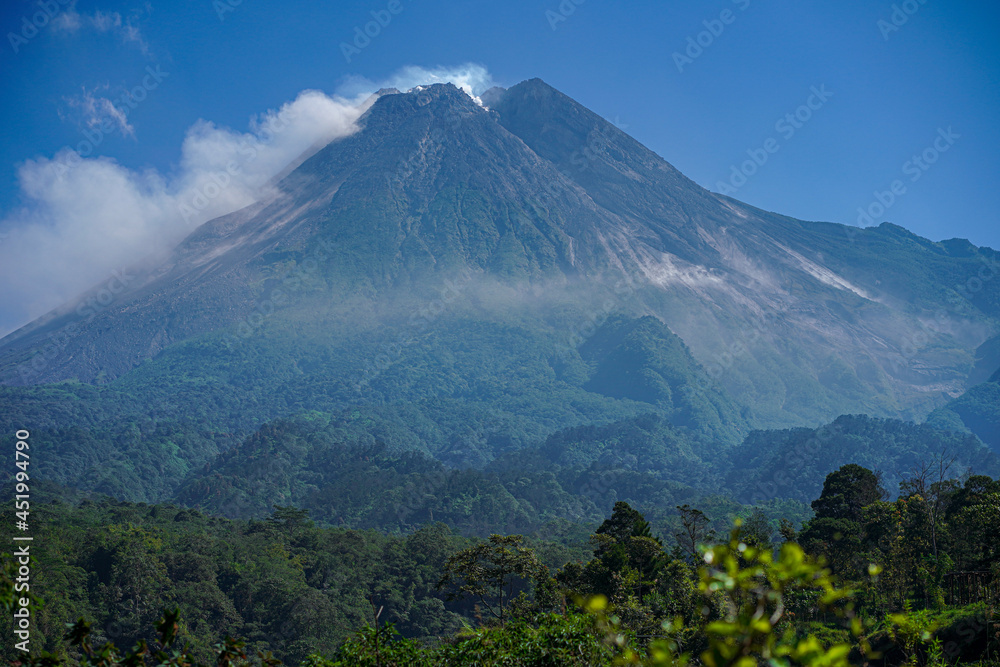 awesome view of Mount Merapi in the morning and emitting smoke, a mountain that is still active until now awesome view of Mount Merapi in the morning and emitting smoke, a mountain that is still active until now