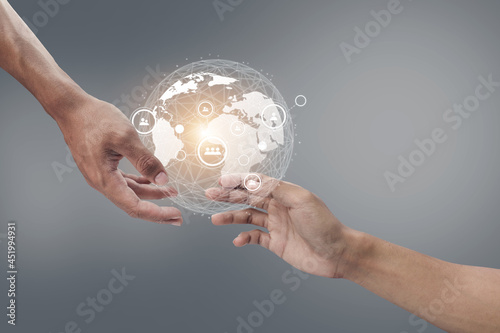 Fototapeta Naklejka Na Ścianę i Meble -  Two people holding hands fintech hologram communication International business.