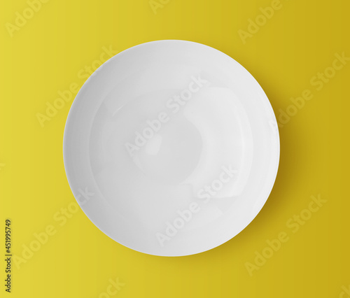 white ceramic plate on yellow