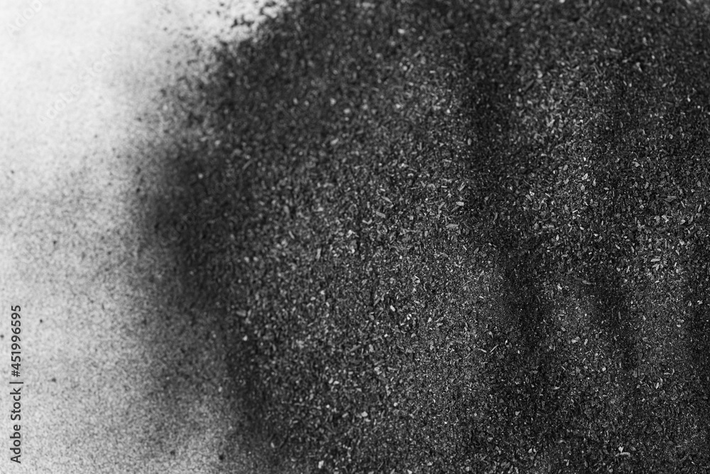 Heap of black coal in powder with fine granules texture Close-up Top view Heap of black coal in powder with fine granules texture Close-up Top view