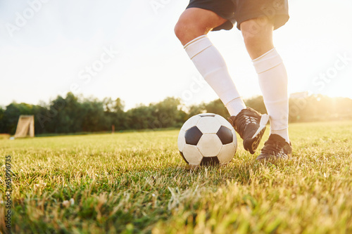 Close up view. Young soccer player have training on the sportive field © standret