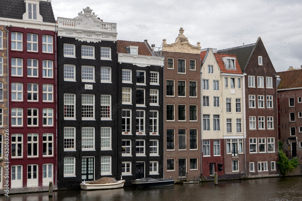 Old Historical Houses At The Canal Around Damrak Amsterdam The Netherlands 16-8-2021