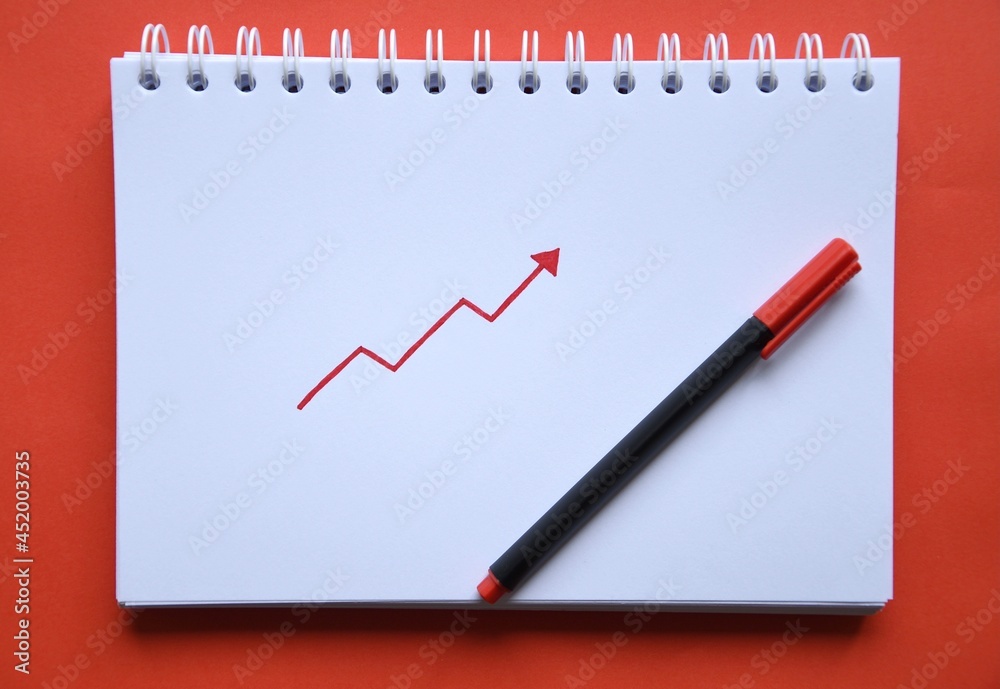 Photo of a drawing of a red arrow pointing up Photo of a drawing of a red arrow pointing up