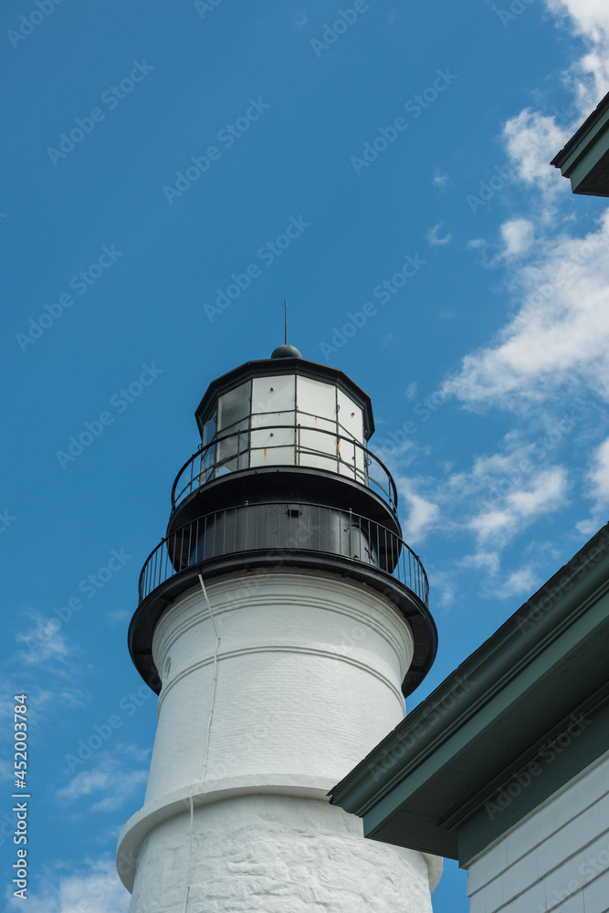The light tower of the Portland Head Lighthouse on a summer day