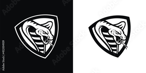 Black and white silhouette of a cobra in a shield.