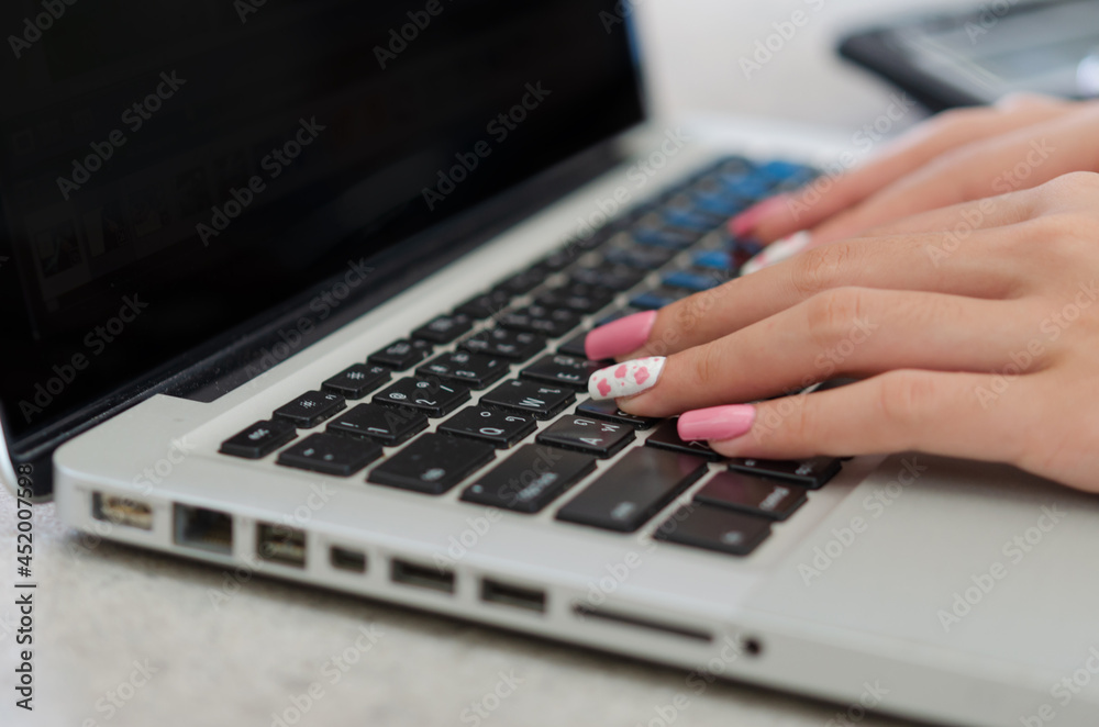 Close up hand woman using a laptop computer keyboard. concept technology business Close up hand woman using a laptop computer keyboard. concept technology business