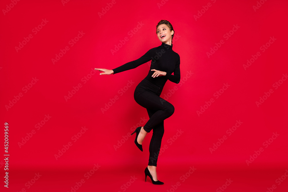Full size profile side photo of young woman happy positive smile party holiday x-mas isolated over red color background