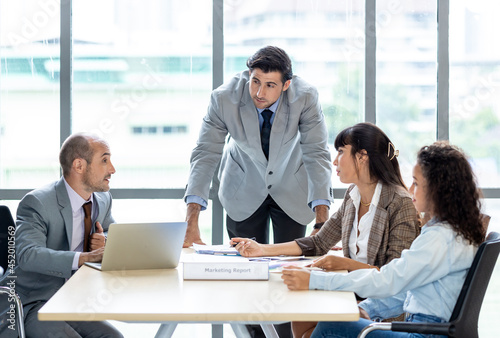 Businesspeople discussing together in the conference room during meeting at the office.