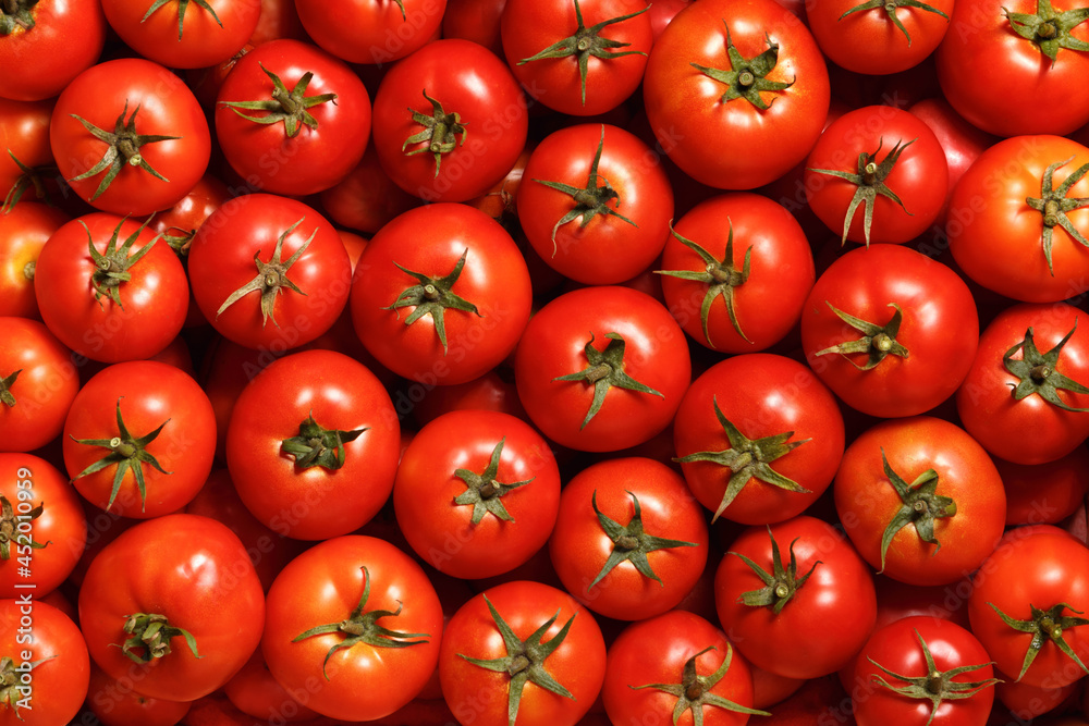 Ripe red tomatoes. Food background. Top view.
