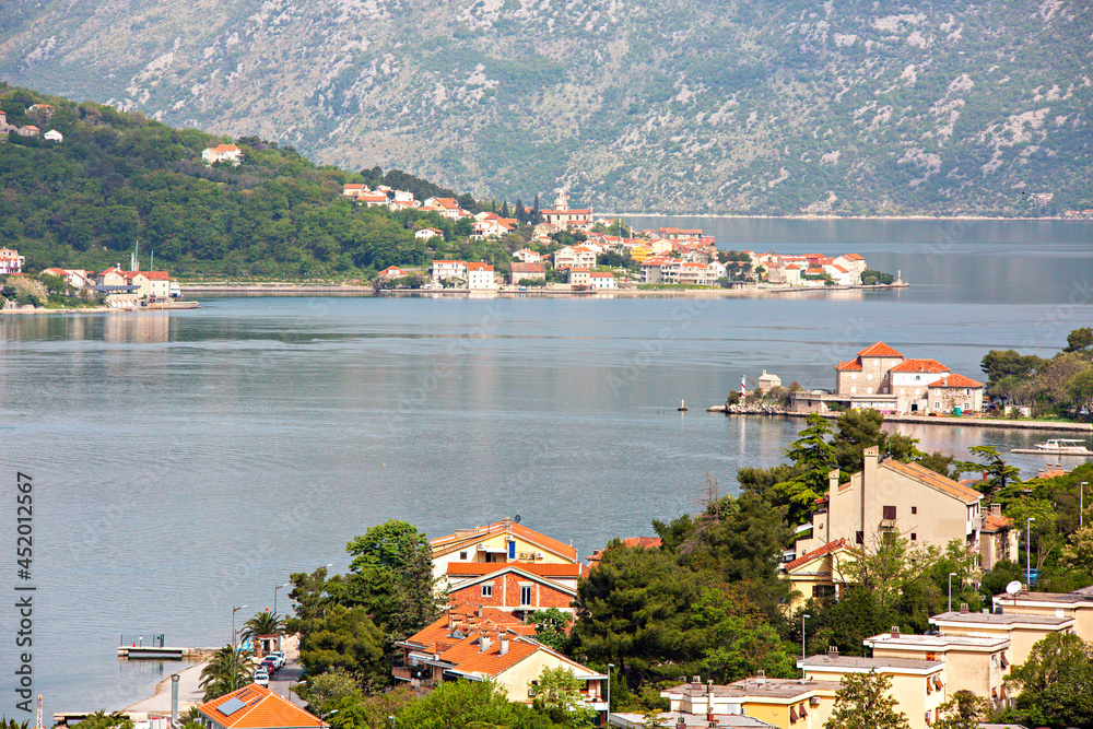 Summer homes on the coastline of the town of Kotor in Kotor Bay, Montenegro