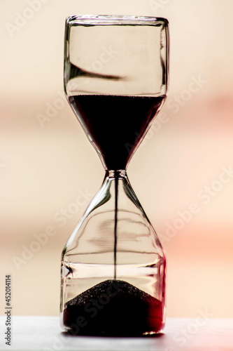 A black glass sand clock 