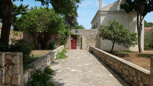 Fototapeta Naklejka Na Ścianę i Meble -  Walking small and quite streets and gardens in town in Croatia in summer near sea 