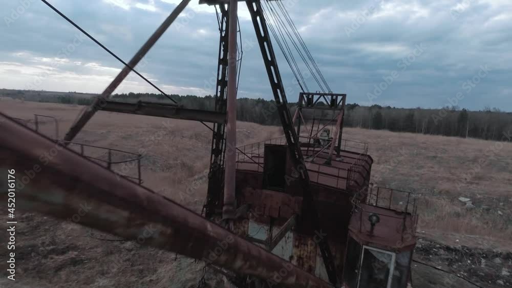 FPV drone flies smoothly near rusty abandoned walking excavator FPV drone flies smoothly near rusty abandoned walking excavator