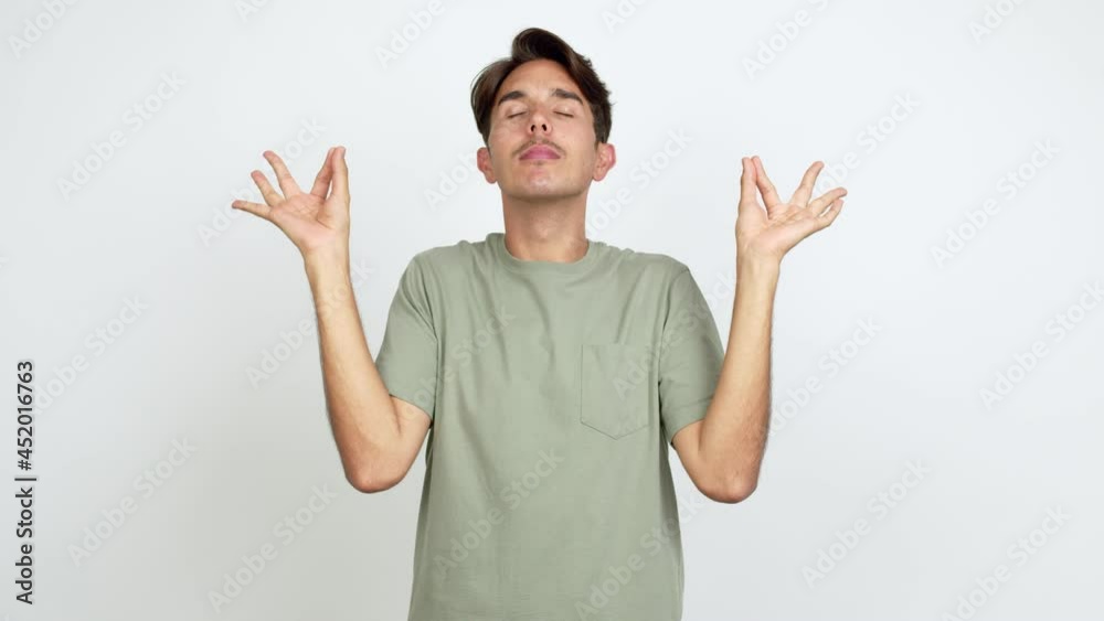 Young man in zen position over isolated background Young man in zen position over isolated background