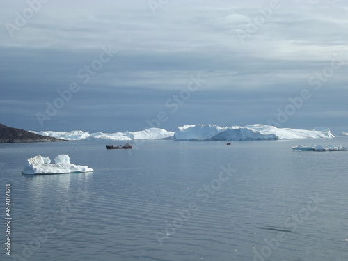 The mighty ice barrier near Ilulissat  Greenland  is formed from glacier ice of the Semeq Kujallek glacier floating through the kanga icefjord towards the open sea