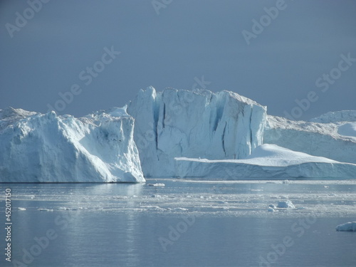 The mighty ice barrier near Ilulissat, Greenland, is formed from glacier ice of the Semeq Kujallek glacier floating through the kanga icefjord towards the open sea
