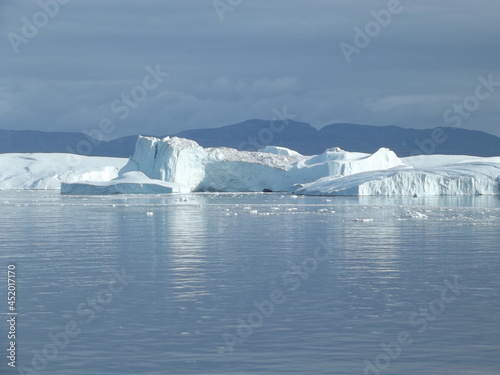 The mighty ice barrier near Ilulissat, Greenland, is formed from glacier ice of the Semeq Kujallek glacier floating through the kanga icefjord towards the open sea
