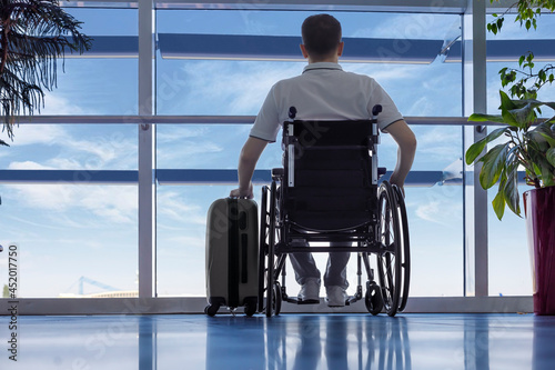Young man in a wheelchair at the airport