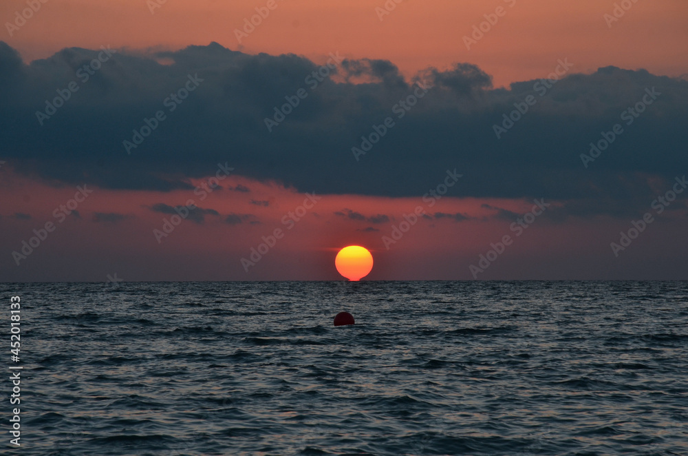 Sunset and surf on the beach in Loo, Russia, Krasnodar Territory Sunset and surf on the beach in Loo, Russia, Krasnodar Territory