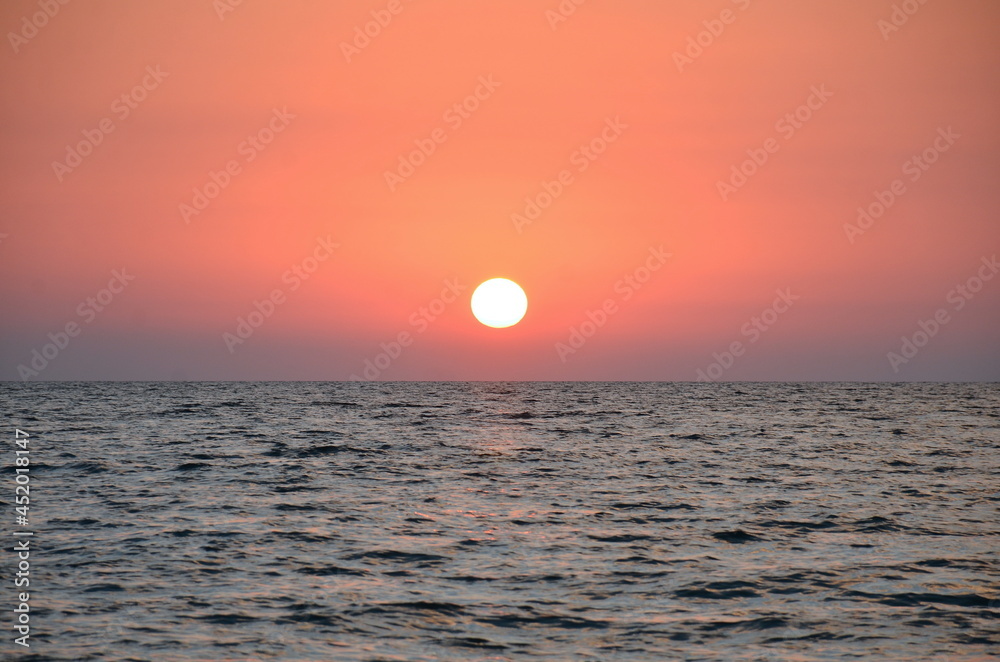 Sunset and surf on the beach in Loo, Russia, Krasnodar Territory