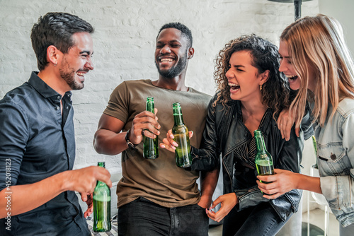 Canvas Print Friends having fun while drinking beer together.