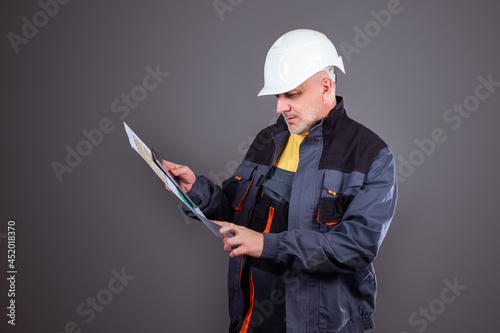 The Builder studies the dra...