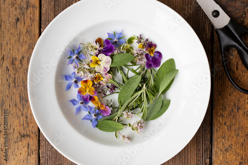 Canvas Print Edible flowers and herbs freshly picked from the garden