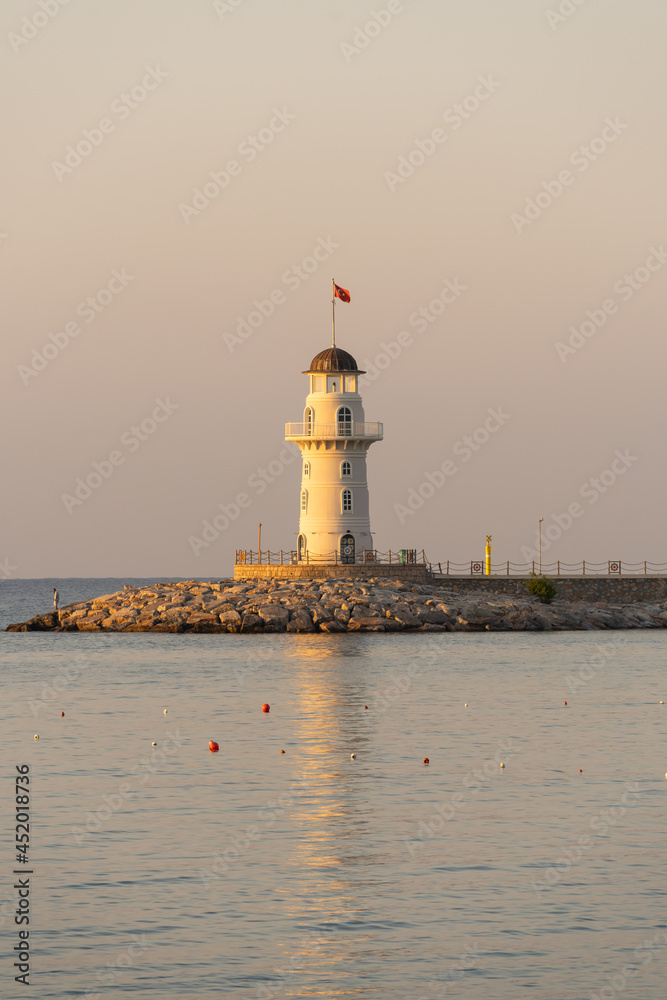 White lighthouse in the port of Alanya, Turkey.