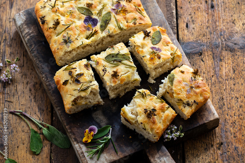 Freshly baked focaccia with herbs and flowers