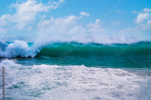 Huge wave curling over and breaking during cyclone Ola