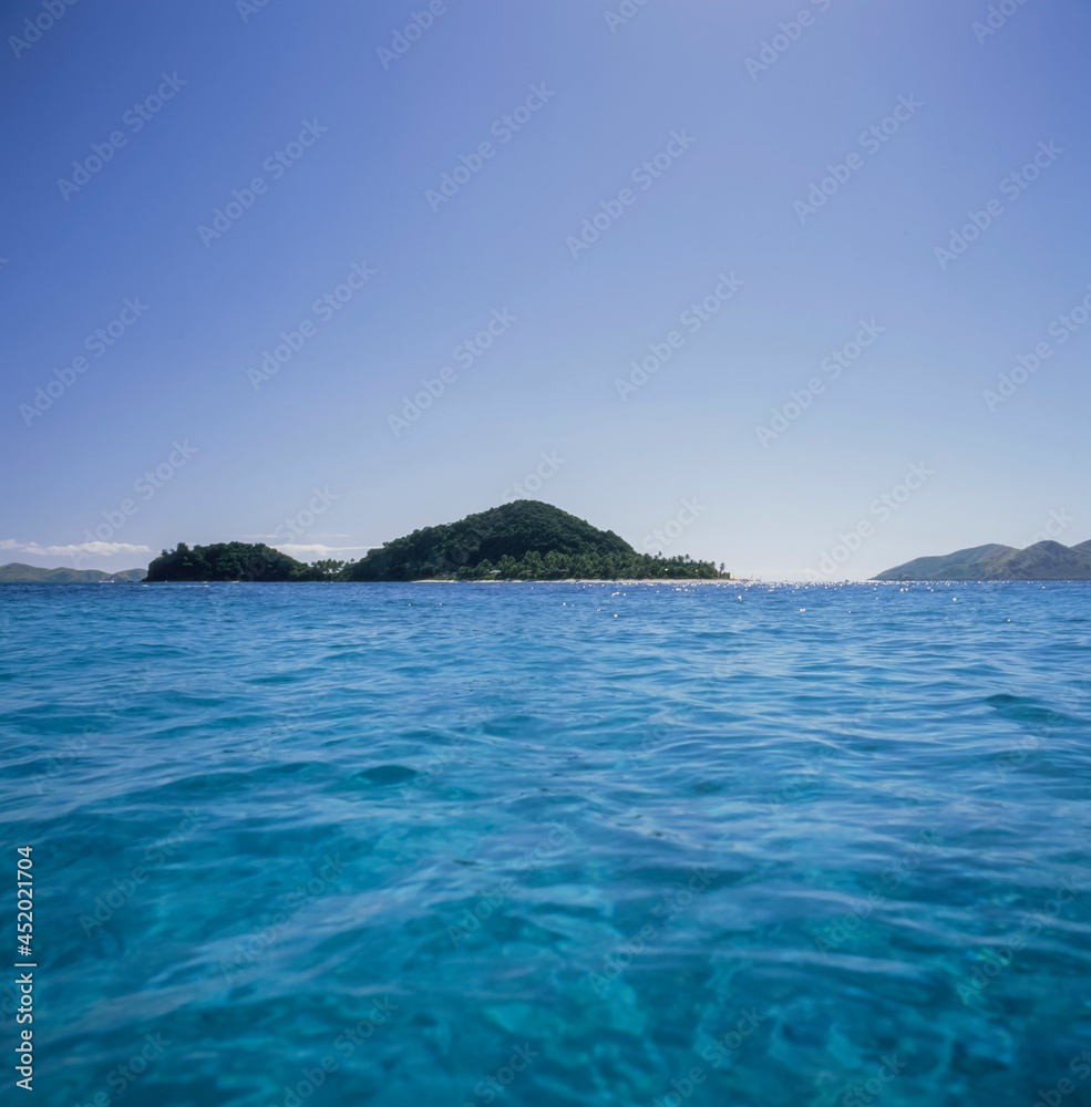Looking across tropical water to Matamanoa Island - Fiji Islands