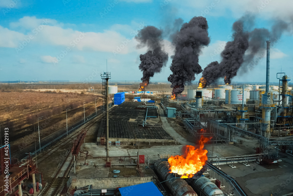 Fototapeta premium Collage. Fire at refinery. Flames and smoke of fire.