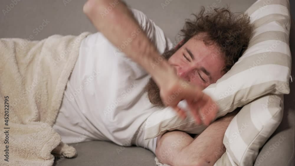 Wake up. Man throws pillow at a girlfriend. Sleep on the sofa the guy was guilty. High quality 4k footage. Wake up. Man throws pillow at a girlfriend. Sleep on the sofa the guy was guilty. High quality 4k footage.