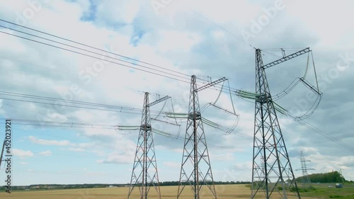 Survey of high-voltage power lines by a quadrocopter. High Voltage Electricity Transmission Pylon.Power Lines Supply With Wire.High Voltage Electric Tower With Insulators.