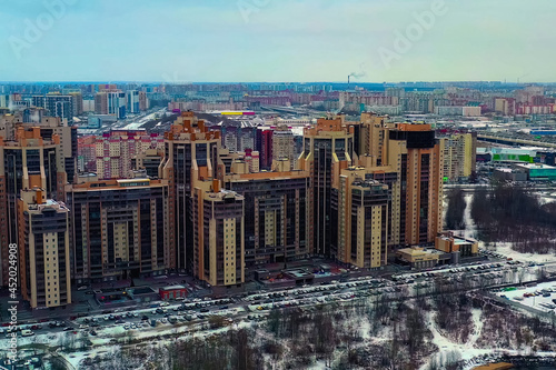 High-rise residential buildings. Yellow orange houses photo