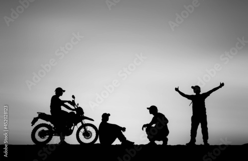 Fototapeta Naklejka Na Ścianę i Meble -  Silhouette Man traveling motocross multiple poses on sky