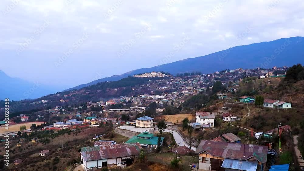 tawang city time lapse view from mountain top at dawn from flat angle