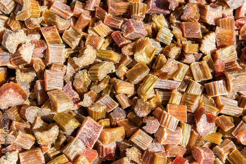Chopped and candied rhubarb as candied fruits. Natural background of dried fruits.