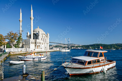 Ortakoy Mosque known also as Mecidiye Mosque, with the Bosphorus Bridge in the background, in Istanbul, Turkey