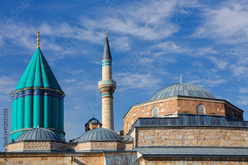 Skyline of Konya with the green dome of the Mausoleum of Mevlana Rumi and Selimiye Mosque, Konya, Turkey.