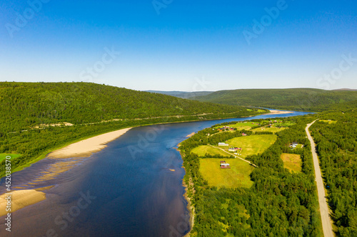 Aerial view of river Karasjohka, fields and forest at the border of Finland and Norway photo