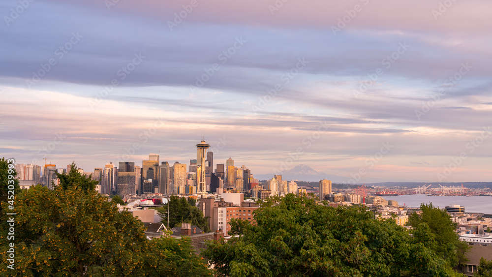 View of Downtown Seattle Skyline at Sunset With Mount Rainer in the Background View of Downtown Seattle Skyline at Sunset With Mount Rainer in the Background
